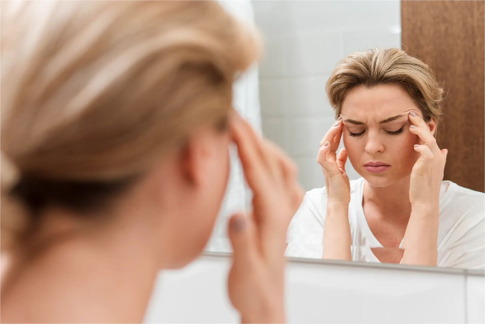 Woman looking in a mirror